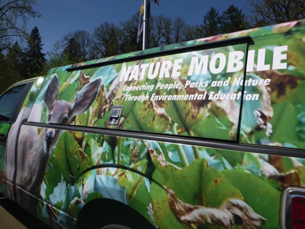 Nature Mobile van - written on van: Connecting People, Parks and Nature Through Environmental Education
